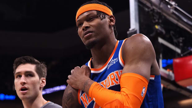 New York Knicks forward Cam Reddish (21) leaves the court holding his right shoulder during the fourth quarter against the Sacramento Kings at Golden 1 Center.